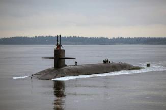 A Trident Submarine Cruising on Hood Canal, Washington ~ I would most likely be in the Engineroom which is behind the men clustered around the hatch on the right side of the photol
